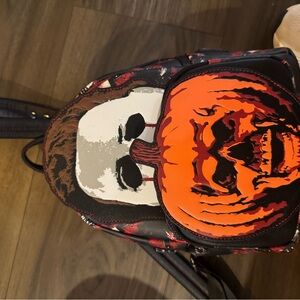 Halloween Themed Backpack with Mask and Pumpkin Design